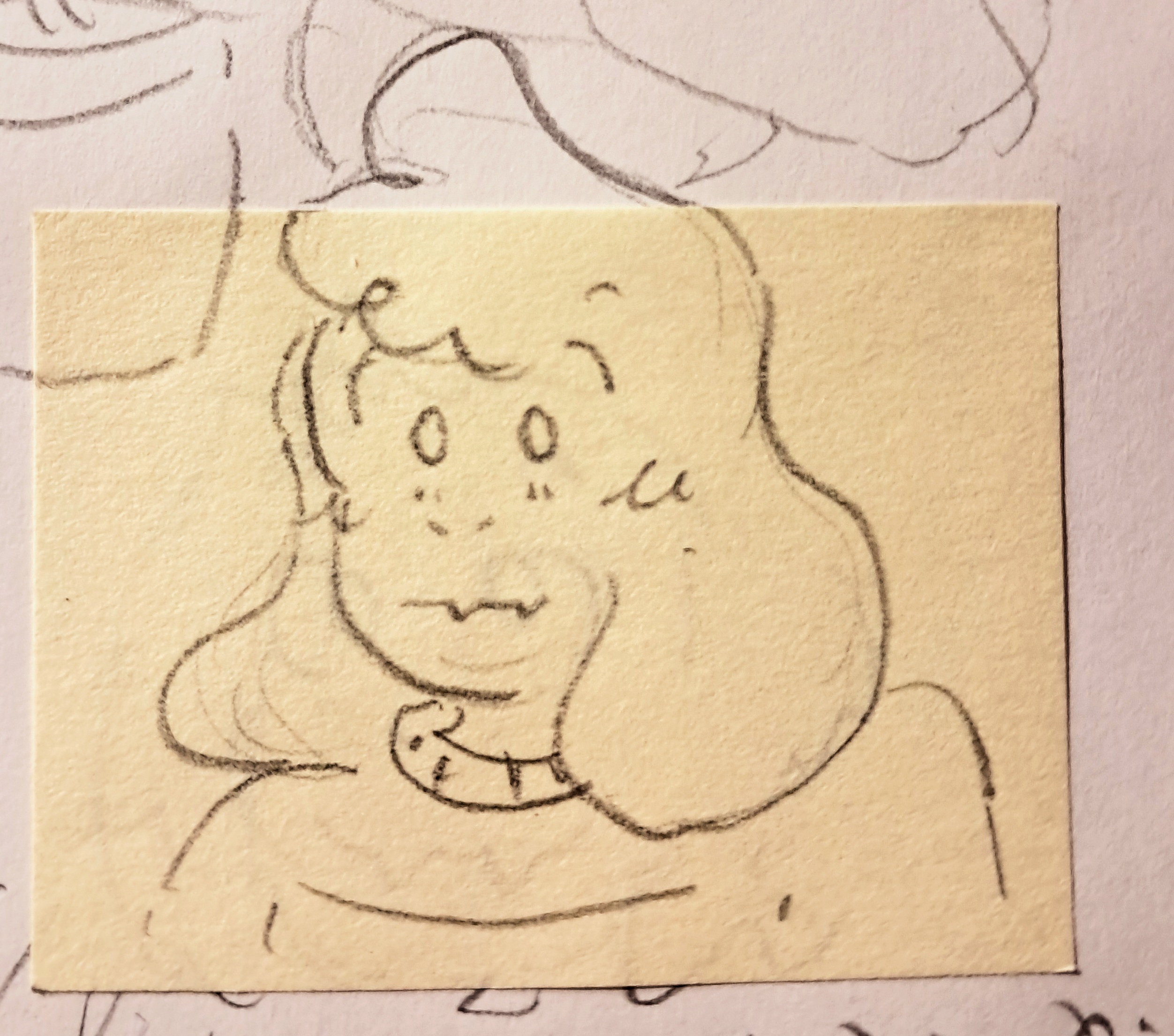 [ID: A picture of a small pencil drawing of Asriel from Undertale. Only his head and the top of his sweater can be seen, as it is a head portrait. He is drawn in a yellow post-it that is pasted over a white sheet, but a little bit of his hair stands out of the post-it and is actually drawn on the white paper. He looks surprised. END ID.]